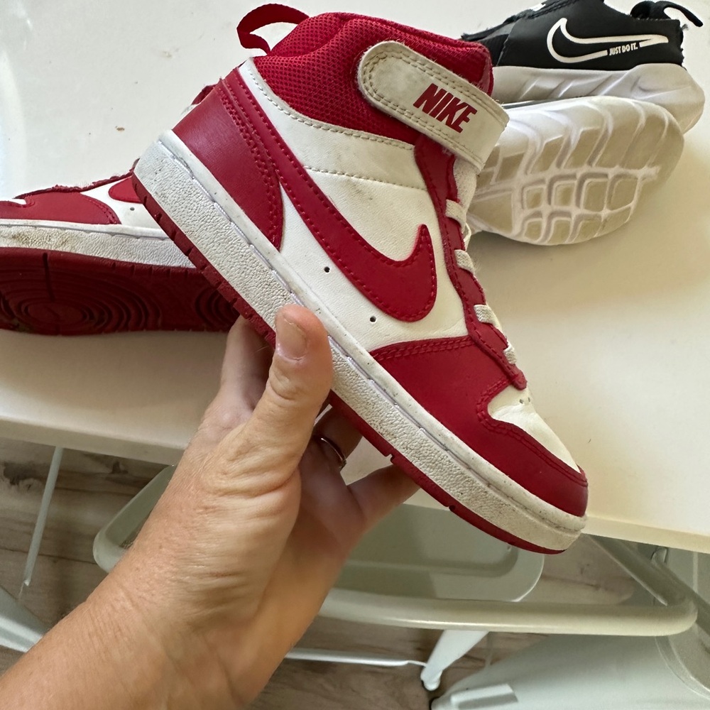 Both pair Nike Kids Red and White High-Top Sneakers